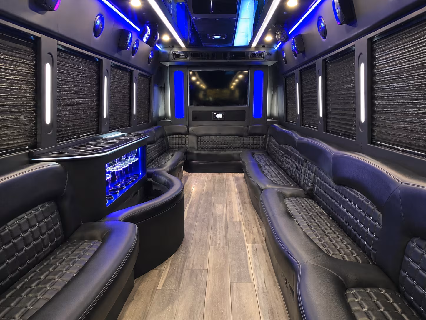 Friends laughing during a party bus celebration in Bridgeport